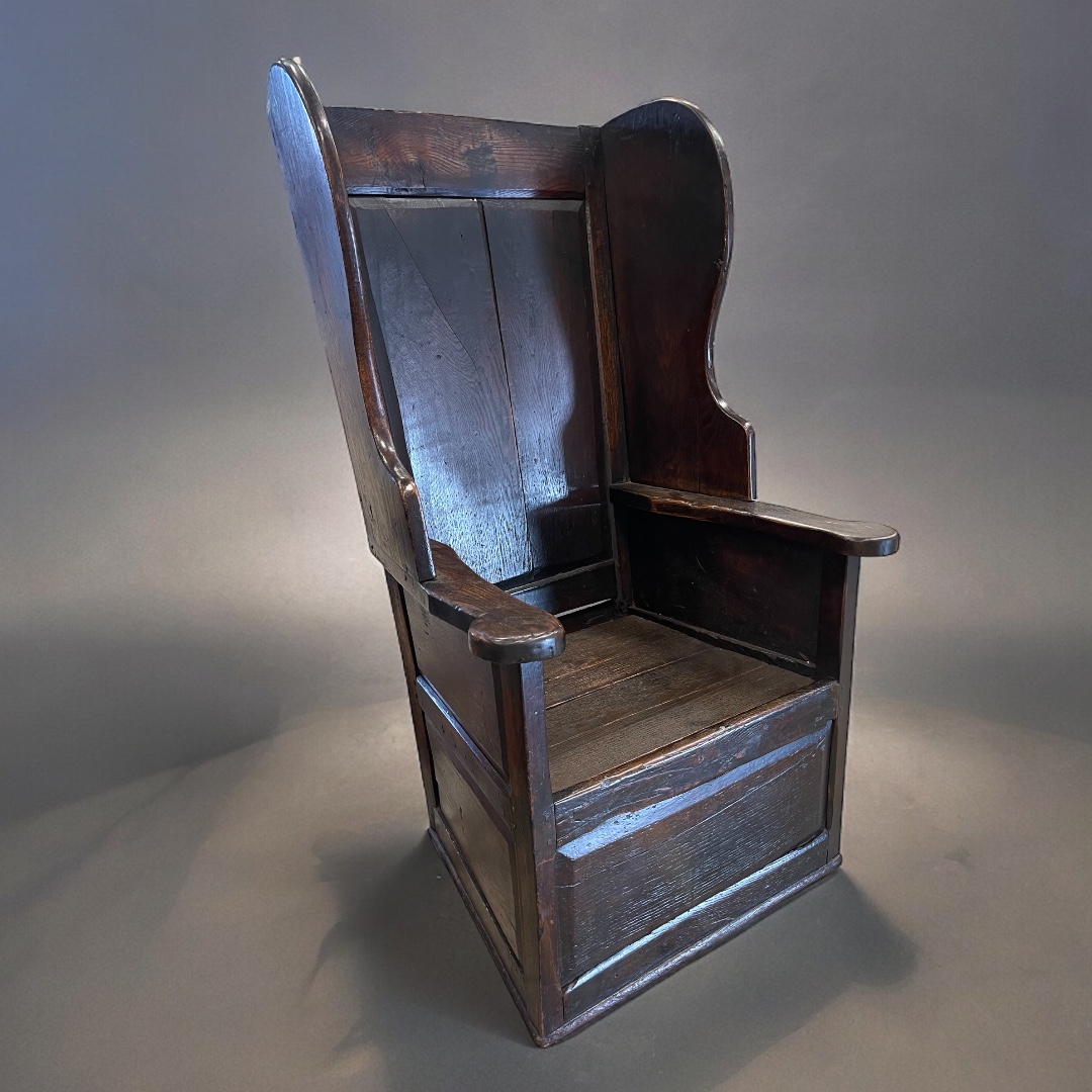 An 18th century English oak Shepherd's chair