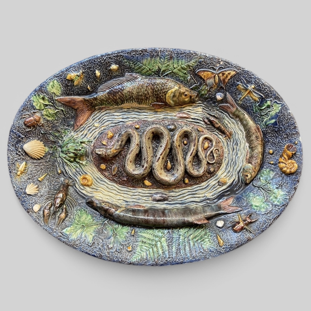 Earthenware plate in the manor of Bernard Palissy . 19th century 